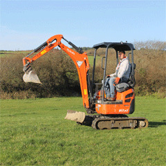 Mini Digger buliding Blockwork, plant, Haverfordwest