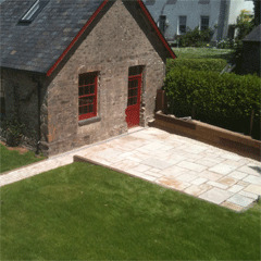 Paved patio with sleeper retaining walls